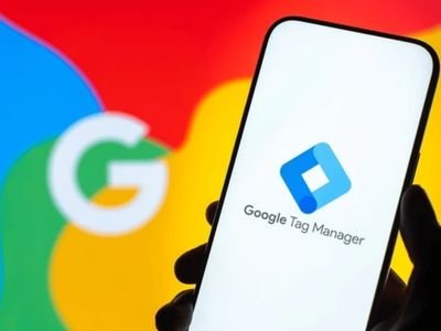Digital marketing professional granting user permissions in Google Tag Manager to securely manage website tracking and analytics.