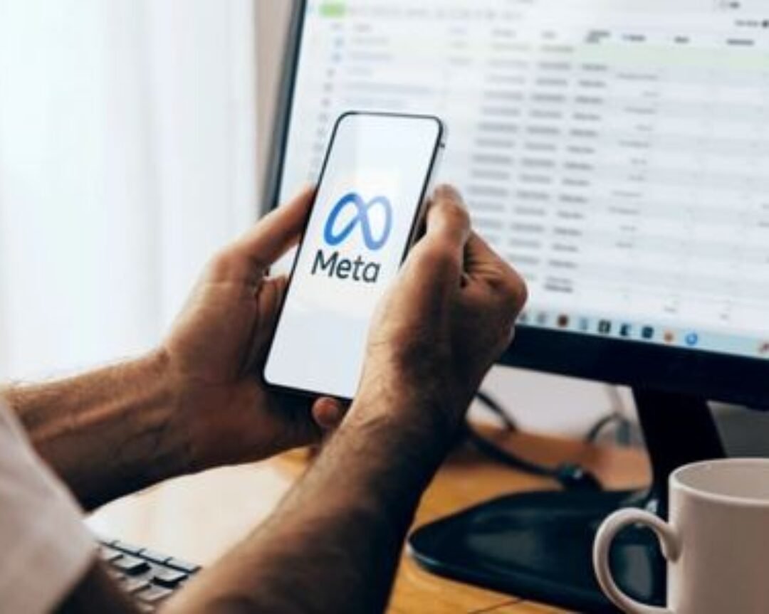 Marketing professional granting user access in Meta Ads Manager to manage Facebook and Instagram advertising campaigns.